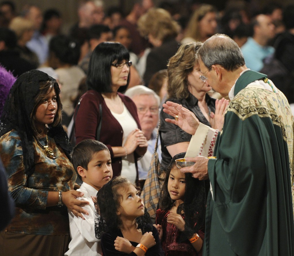 Archbishop William E. Lori of Baltimore blesses children during an Oct. 14 Mass and Pilgrimage for Life and Liberty at the Basilica of the National Shrine of the Immaculate Conception in Washington. Archbishop Lori, chairman of the U.S. bishopsâ Ad Hoc Committee for Religious Liberty, was the main celebrant of the Mass, which drew an estimated crowd of nearly 6,000 people.