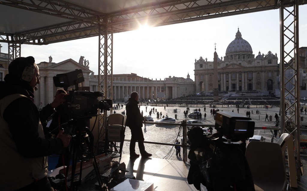 A technician works on a structure set up for TV media in St. Peter's Square at the Vatican Feb. 26, the eve of Pope Benedict XVI's final weekly audience. The papacy of Pope Benedict will officially end Feb. 28 at 8 p.m. Rome time. PHOTO: CNS/Alessandro Bianchi, Reuters