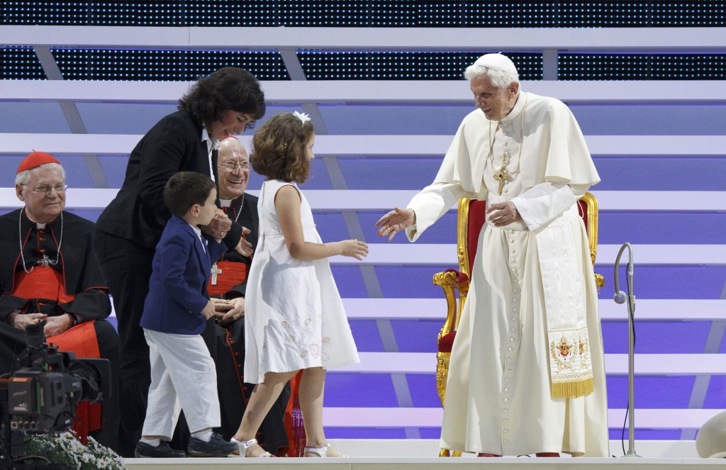 Pope Benedict XVI greets a family as he leads an evening service during the World Meeting of Families on June 2 2012 in Milan. PHOTO: CNS/Paul Haring