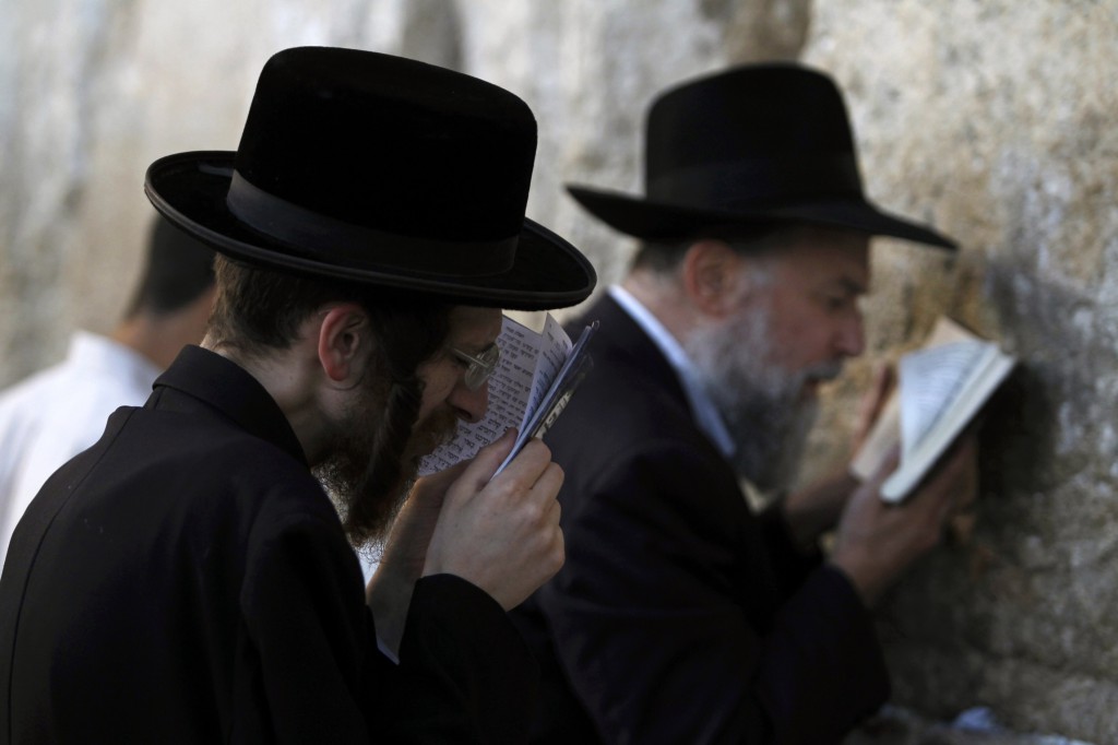 Jewish worshippers pray at the Western Wall, Judaism's holiest site, in Jerusalem's Old City. PHOTO: CNS/Baz Ratner, Reuters