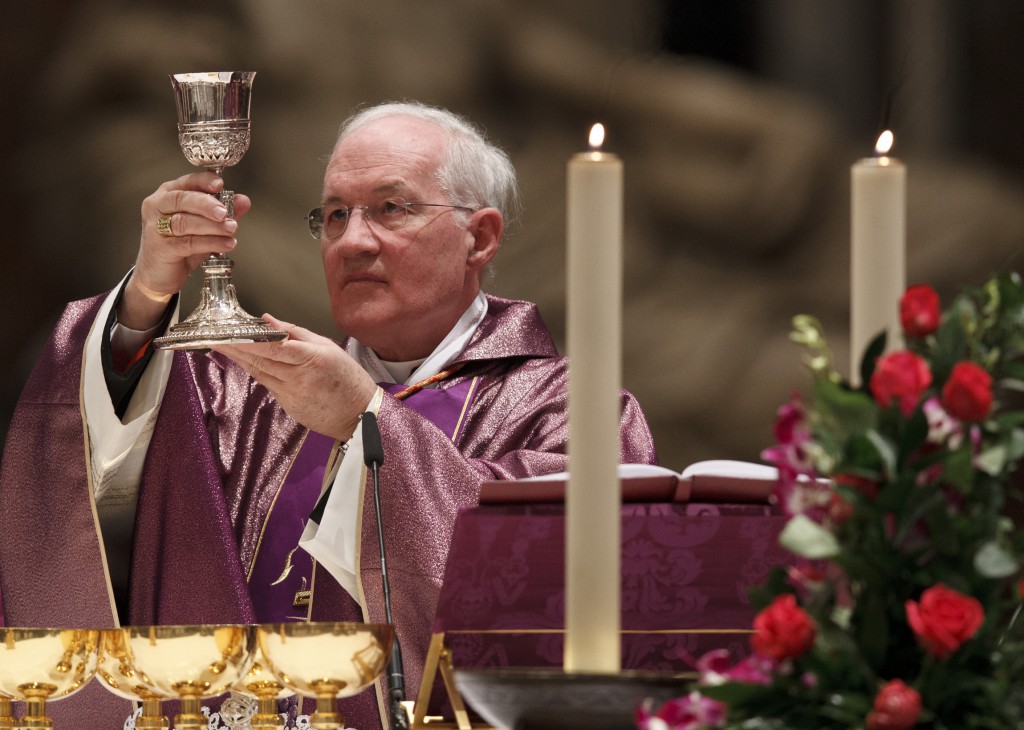 Cardinal Marc Ouellet, prefect of the Vatican's Congregation for Bishops, elevates the chalice during the opening Mass of the International Congress on the Church in America held in St. Peter's Basilica on Dec. 9 at the Vatican. 