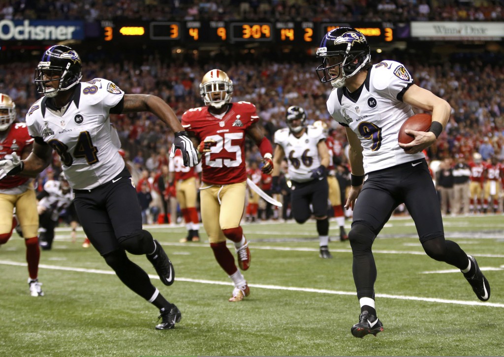 Baltimore Ravens kicker Justin Tucker attempts a first down on a fake kick against the San Francisco 49ers during the second quarter of the NFL Super Bowl XLVII football game on Feb. 3 in New Orleans. PHOTO: CNS/Mike Segar, Reuters