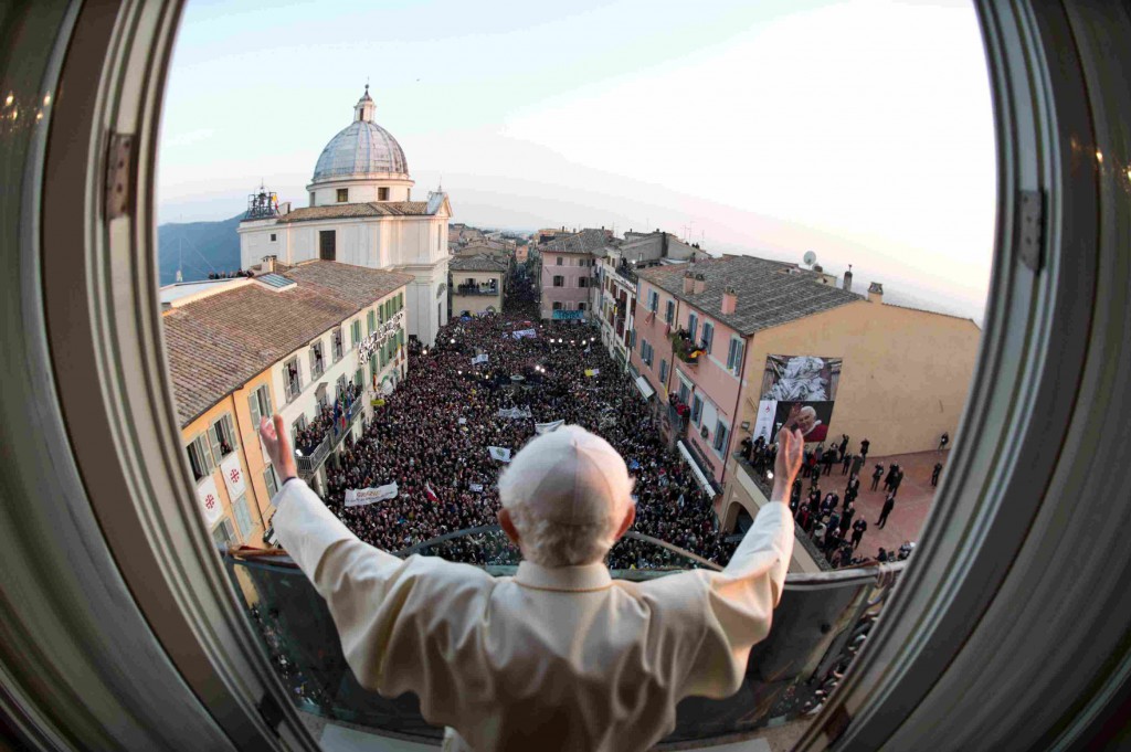 Pope Benedict XVI waves as he appears for the last time as Pope at the balcony of his summer residence in Castel Gandolfo, Italy, on February 28. It was his final public appearance before his papacy drew to a close. PHOTO: CNS/L'Osservatore Romano via Reuters: reuters