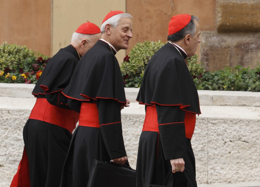 U.S. Cardinals Francis E. George of Chicago, Donald W. Wuerl of Washington and Daniel N. DiNardo of Galveston-Houston arrive on  March 5 for a general congregation meeting in the synod hall at the Vatican. PHOTO: CNS/Paul Haring