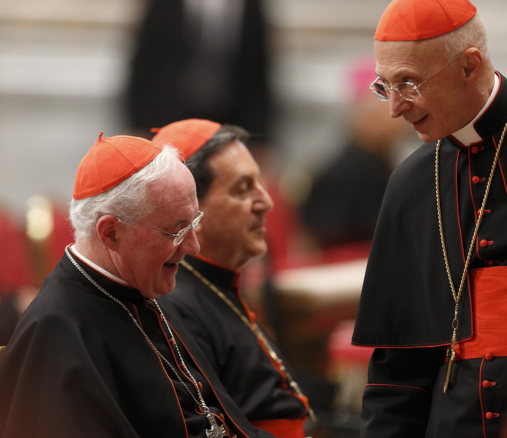 Canadian Cardinal Marc Ouellet, prefect of the Congregation for Bishops, left, Cardinal Ruben Salazar Gomez of Bogota, Colombia, center, and Italian Cardinal Angelo Bagnasco of Genoa, right, are seen before a prayer service with eucharistic adoration in St. Peter's Basilica on March 6 at the Vatican. PHOTO: CNS/Paul Haring