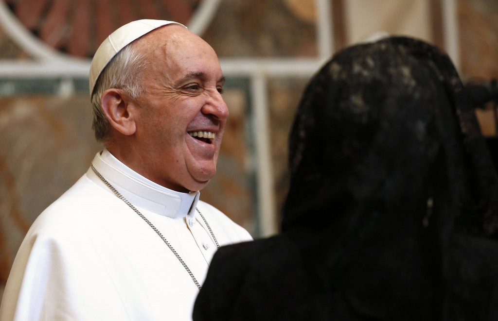 Pope Francis smiles as he greets diplomats during an audience with the Vatican diplomatic corps in the Apostolic Palace Õs Sala Regia March 22. PHOTO: CNS/Tony Gentile, Reuters