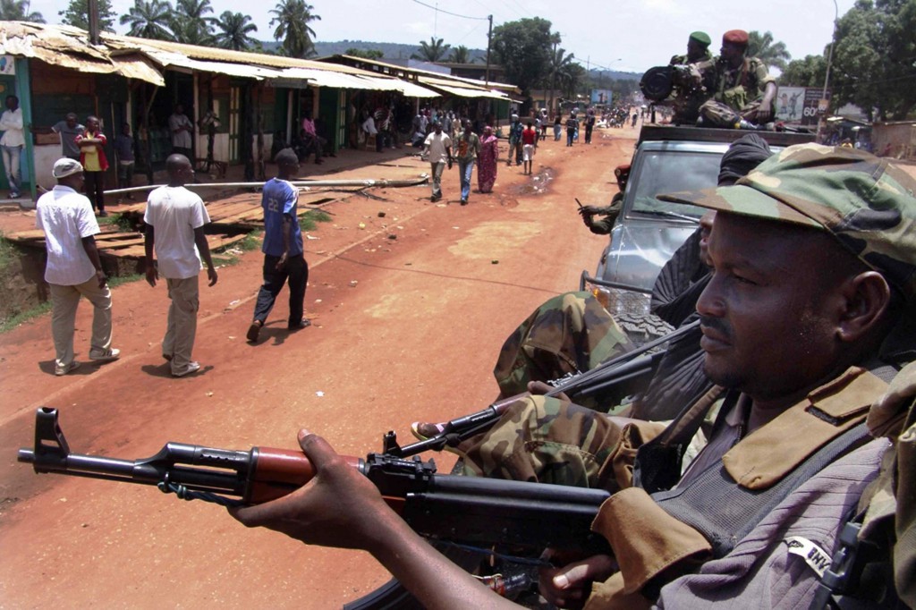 Armed rebel fighters patrol the streets in pickup trucks on March 26 to stop looting in Bangui, Central African Republic. PHOTO: CNS/Alain Amontchi, Reuters