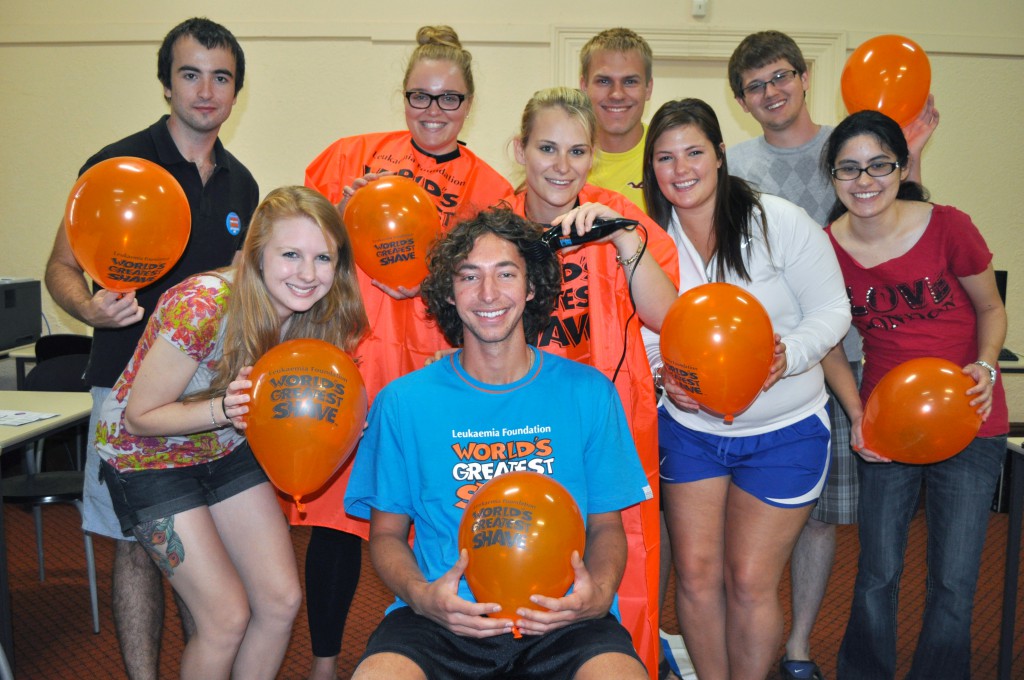 UNDA’s Will Rigali, centre, is supported by fellow Study Abroad students while taking part in the World’s Greatest Shave. PHOTO: UNDA