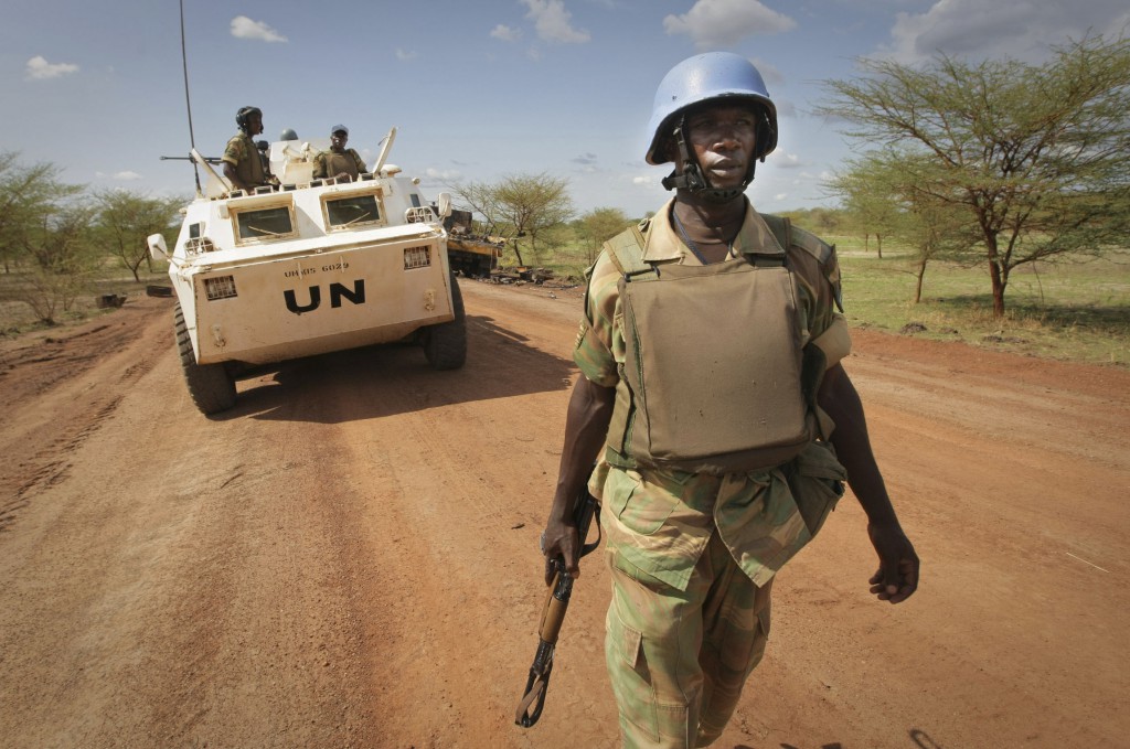 A soldier from Zambia serving with the international peacekeeping operation patrols on the ground in the region of Abyei, central Sudan, in this handout picture released on May 30 by the U.N. Mission in Sudan. PHOTO: CNS/Stuart Price, U.N. via reuters