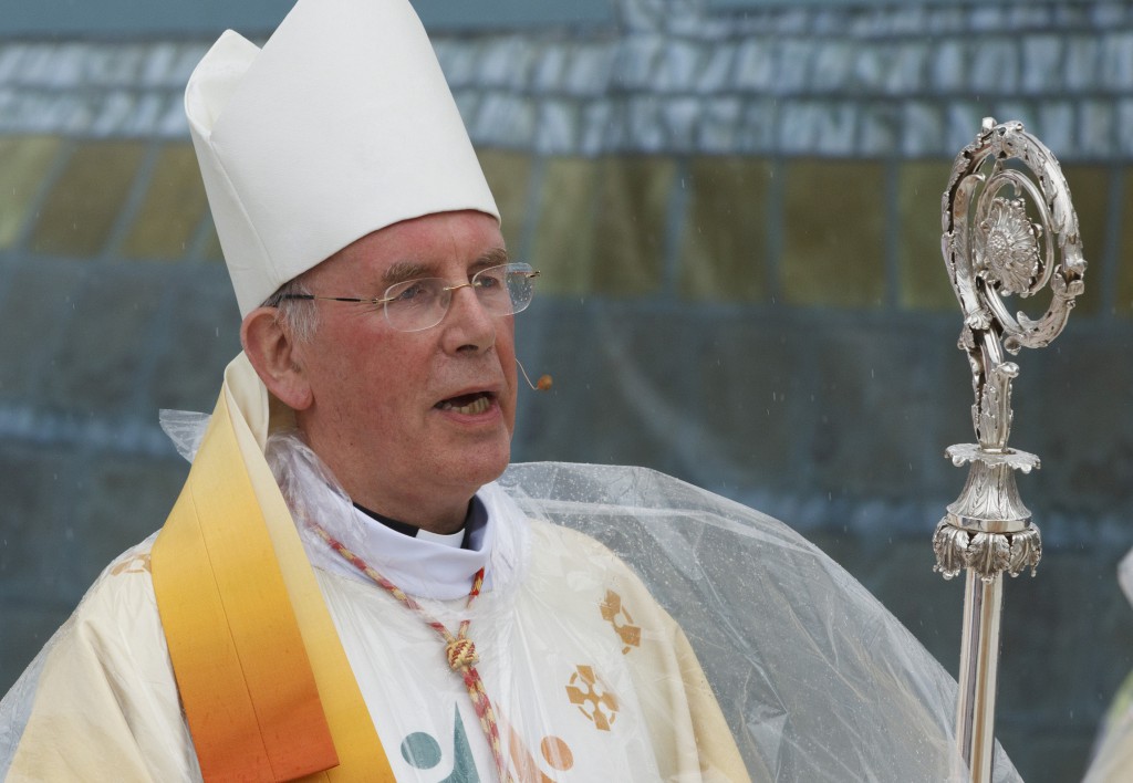 Rain falls as Cardinal Sean Brady of Armagh, Northern Ireland, arrives to celebrate Mass during the 50th International Eucharistic Congress on June 14 in Dublin. PHOTO: CNS/Paul Haring