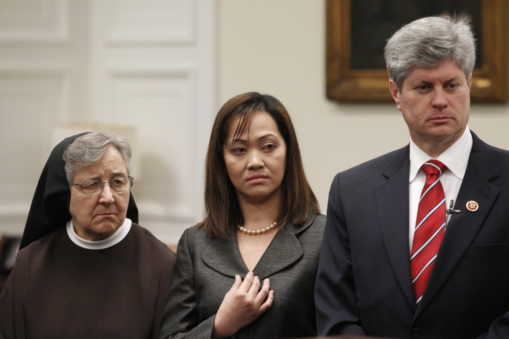 Franciscan Sister Jane Marie Klein, who chairs the board of Franciscan Alliance, registered nurse Cathy Cenzon-DeCarlo and U.S. Rep. Jeff Fortenberry, R-Neb., listens to a speaker during a March 5 press conference on Capitol Hill in Washington. Speakers discussed proposed legislation to address religious freedom concerns about the Health and Human Services contraceptive mandate. PHOTO: CNS/Bob Roller 