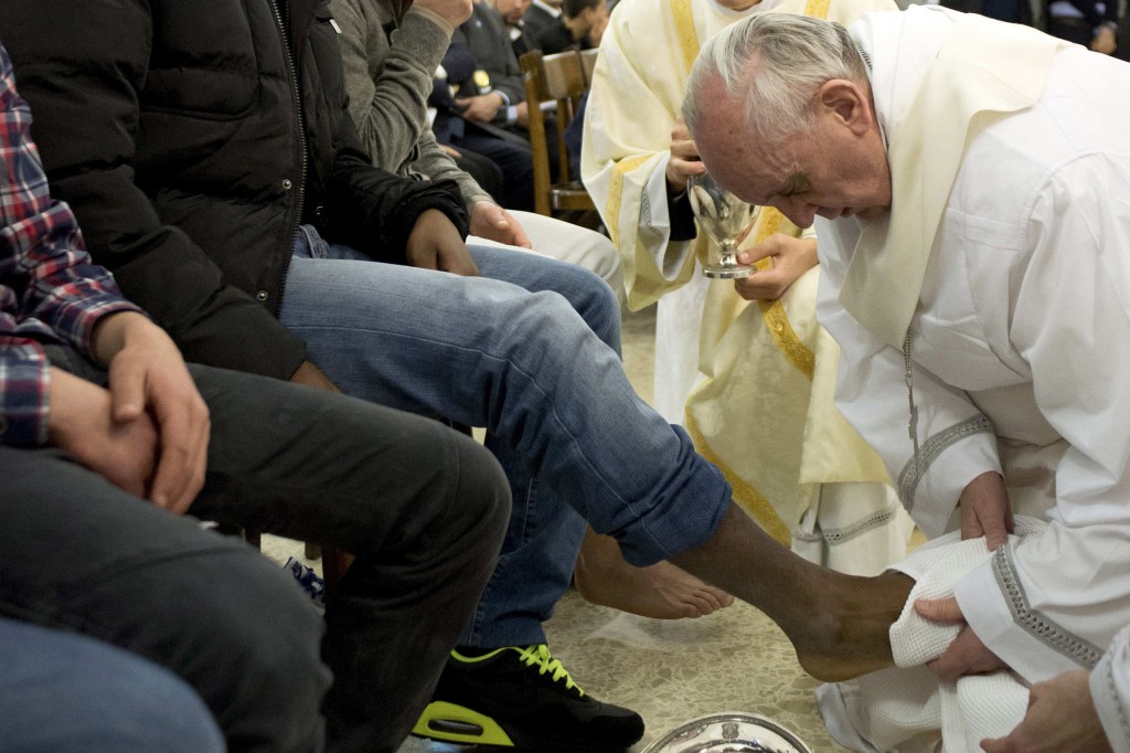 Pope Francis washes the foot of a prison inmate during the Holy Thursday Mass of the Lord's Supper on March 28 at Rome's Casal del Marmo prison for minors. PHOTO: CNS/L'Osservatore Romano via Reuters