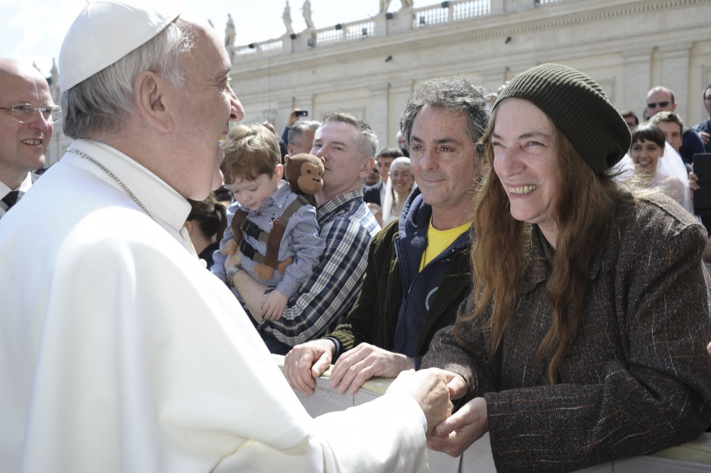 Pope Francis greets U.S. singer Patti Smith during his weekly audience on April 10 in St. Peter's Square at the Vatican. PHOTO: CNS/L'Ossevatore Romano via Reuters