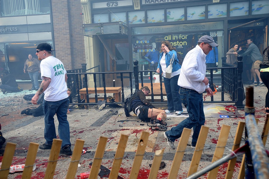 Wounded spectators lie injured following explosions on April 15 at the Boston Marathon. PHOTO: CNS/MetroWest Daily News/Ken McGagh, handout via Reuters