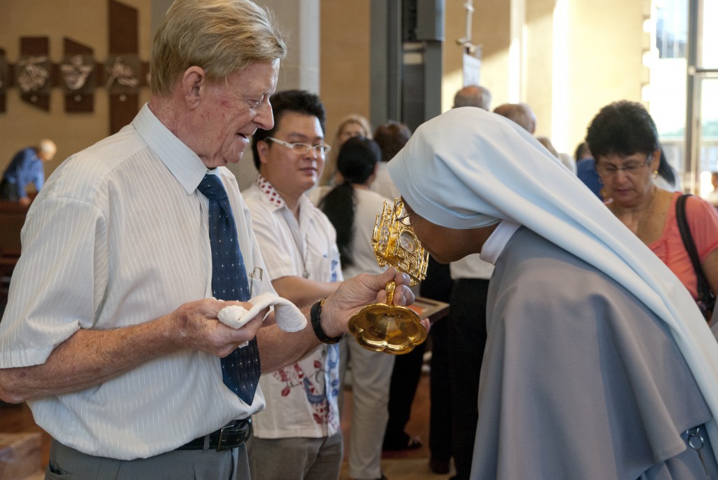 Participants come forward to venerate relics of St Faustina Kowalska, founder of the Divine Mercy devotion, in St Mary’s Cathedral last Sunday. The first Sunday after Easter was established by Pope John Paul II as the feast of Divine Mercy after St Kowalska’s canonisation in 2000. PHOTO: Matthew Biddle