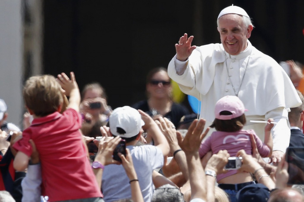 Pope Francis waves at the end of a Mass where he canonized the first Colombian saint, as well as a Mexican nun and some 800 Italians martyred by Ottoman Turks in the 15th century. PHOTO: CNS/Stefano Rellandini, Reuters