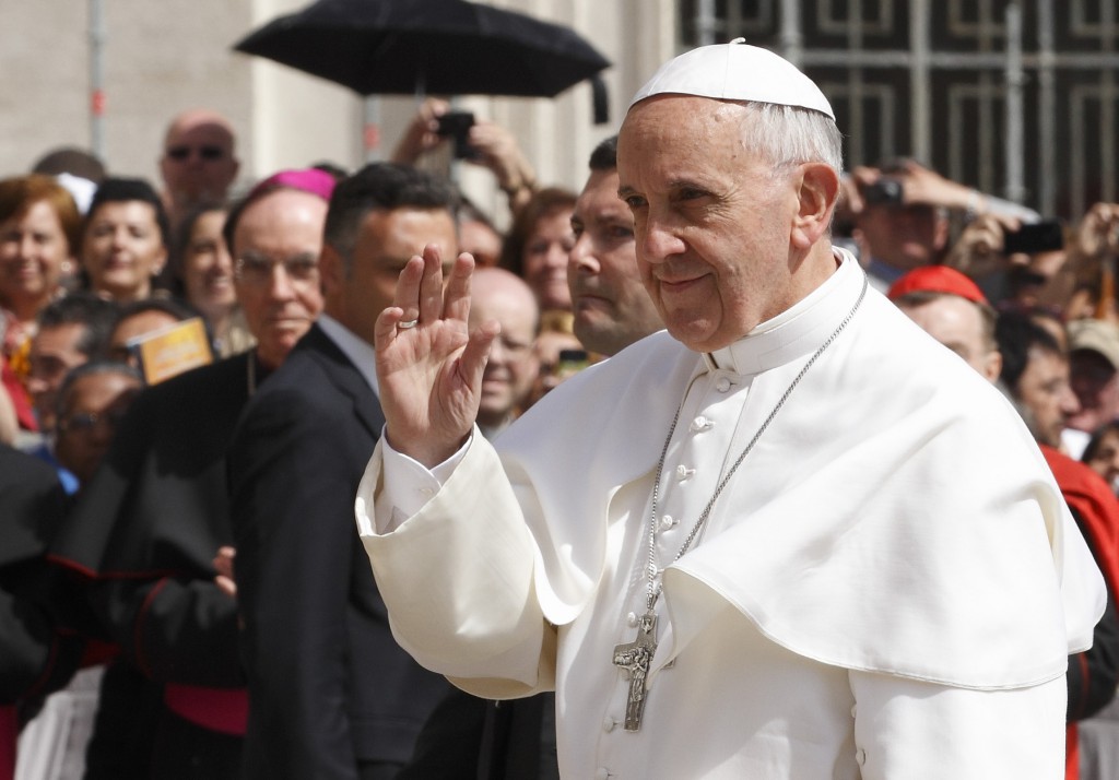 Pope Francis waves as he arrives to lead his general audience on May 22 in St. Peter's Square at the Vatican. PHOTO: CNS/Paul Haring