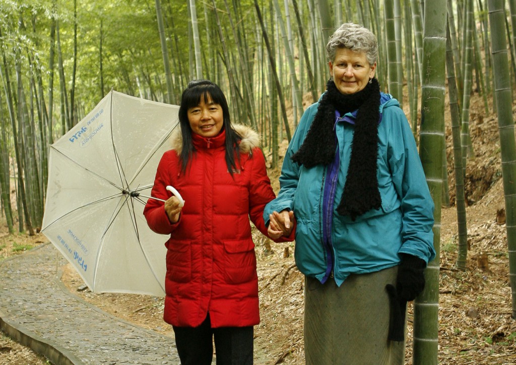 A guide leads a U.S. visitor through the bamboo forest at the foot of the Minor Basilica of Our Lady of Sheshan near Shanghai. PHOTO: CNS/Nancy Wiechec