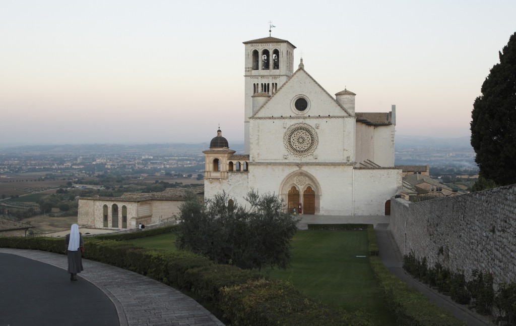 A nun walks near the Basilica of St. Francis in the early morning in 2011 in Assisi, Italy. Pope Francis will visit the birthplace of his namesake, St. Francis of Assisi, on Oct. 4 for the saint's feast day. PHOTO: CNS/Paul Haring