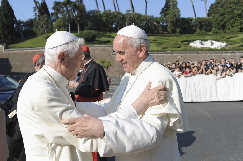 Pope Francis, right, embraces retired Pope Benedict XVI during a ceremony on July 5 in the Vatican gardens. PHOTO: CNS/L'Osservatore Romano via Reuters