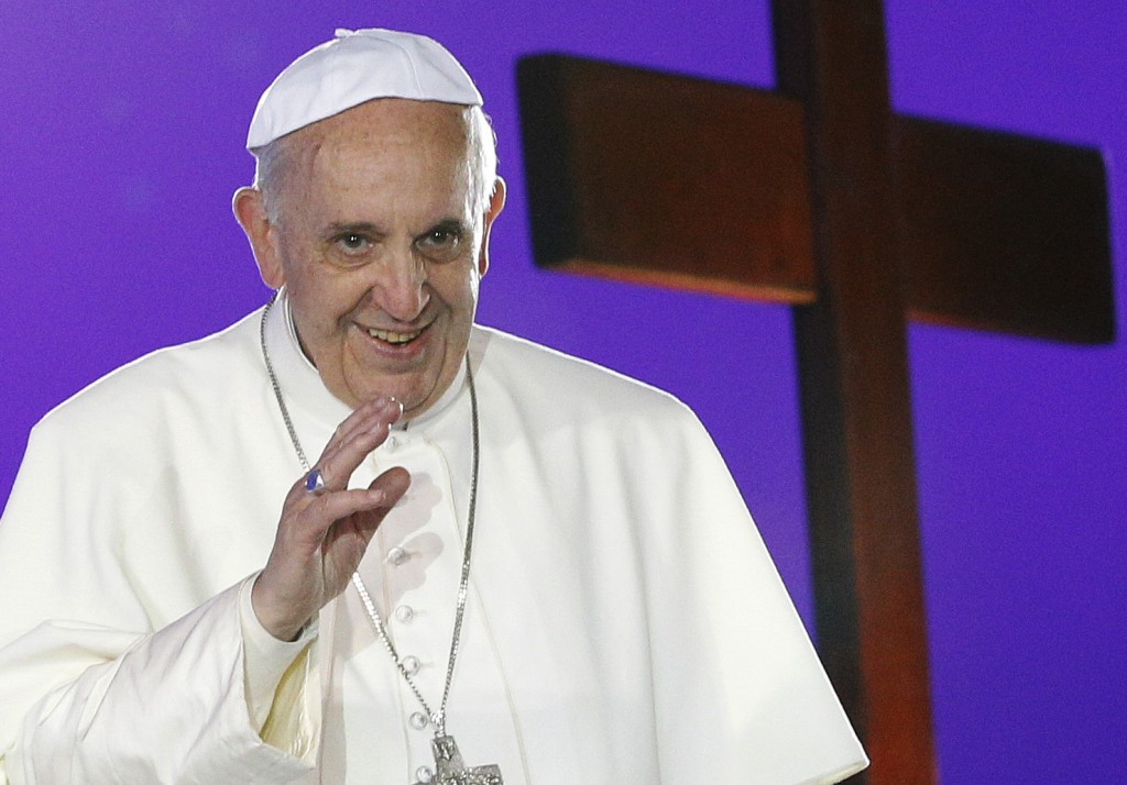 Pope Francis greets the crowd on July 25 as he arrives for the World Youth Day welcoming ceremony on Copacabana beach in Rio de Janeiro. The rankings of highest number of retweets worldwide, released on  July 24, showed that on Twitter Pope Francis is the most influential world leader. PHOTO: CNS/Paul Haring