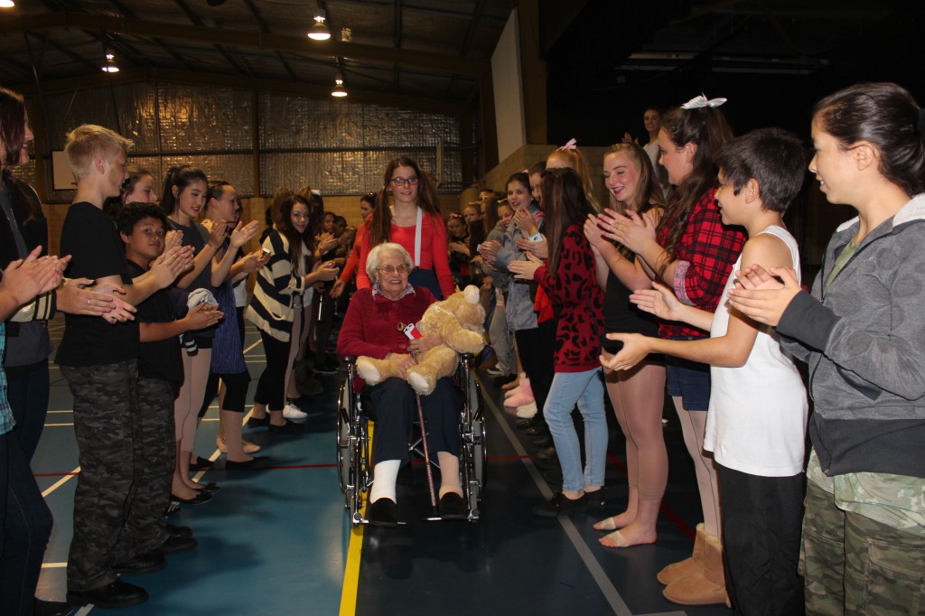 Kolbe students form a guard of honour for Pat Davis and Emily Benge. The ladies were two of the three, including Rod Bartolomewsz, whose lives were interpreted in dance by teacher Sally Shannassy and students.Photo: leanne joyce