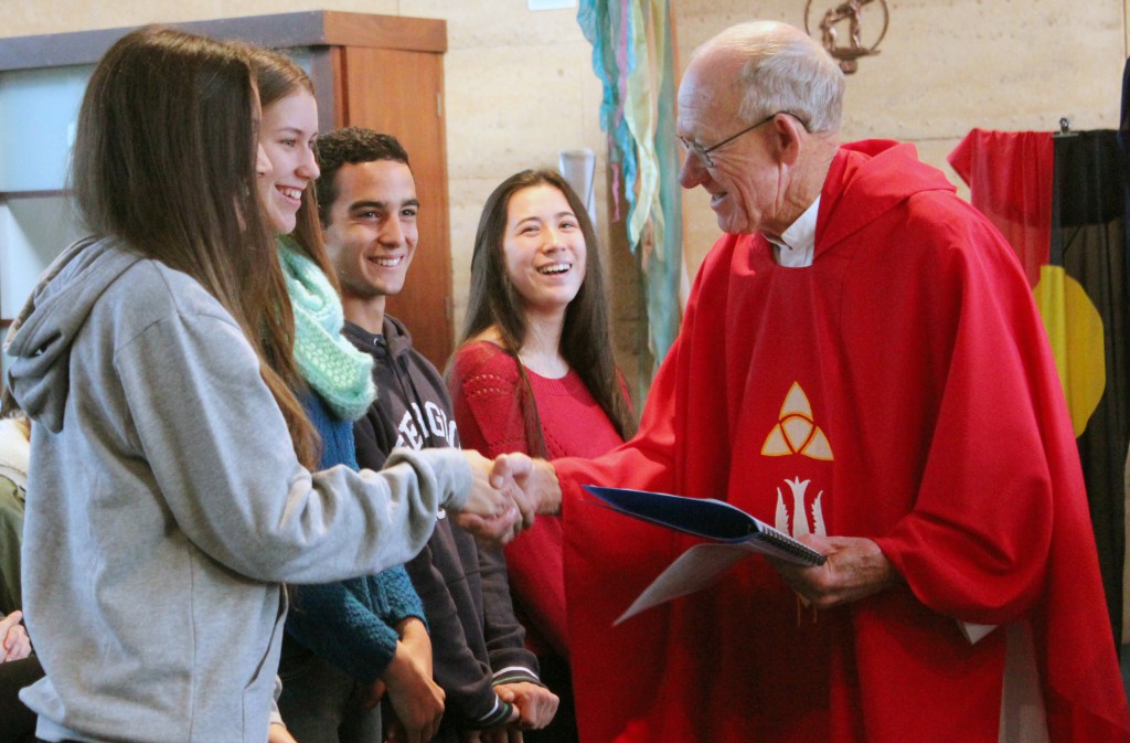 Baldivis parish priest Fr Geoff Aldous with Kolbe Catholic College students. The college celebrated a special NAIDOC Mass on Wednesday, July 3.  PHOTO: Leanne Joyce