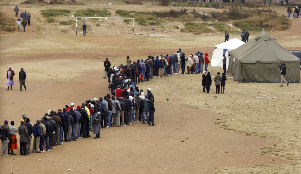 Zimbabweans wait in line to cast their votes in Mbare township outside Harare July 31. A Zimbabwe church official says while the fairness of the election process is in dispute, Zimbabweans were able to cast their votes freely. PHOTO: CNS/Siphiwe Sibeko, Reuters