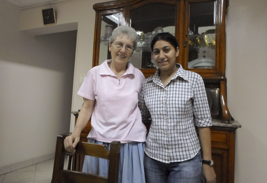 Canadian Sister Darlene DeMong, a member of the Congregation of Notre Dame de Sion, stands with a novice at the order's residence in Cairo Aug. 22. The nun told Catholic News Service that while in the south in Berba days before, Muslim neighbors helped to guard a convent, church and other Christian facilities, while elsewhere in the country attacks against Christian properties were being carried out. PHOTO: CNS/James Martone