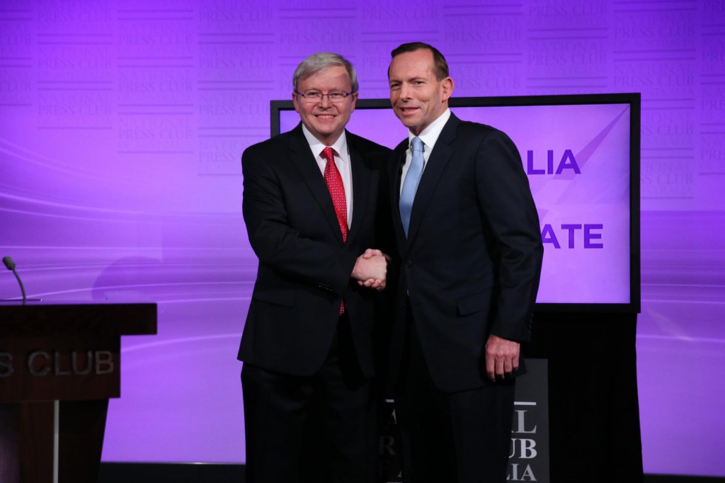 Prime Minister Kevin Rudd and Opposition Leader Tony Abbott shake hands at the commencement of the Leaders Debate at the National Press Club on August 11, 2013 in Canberra, Australia. PHOTO: Gary Ramage-Pool/Getty Images