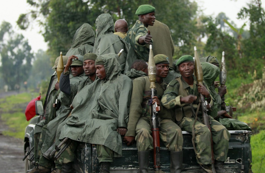 Congolese soldiers ride on their pick-up truck as they advance to a new position while battling M23 rebels in Goma Sept. 2. Bishop Willy Ngumbi Ngengele of Kindu said many communities in the area continue to suffer from the strikes committed by the M23 rebels. PHOTO: CNS/Thomas Mukoya, Reuters