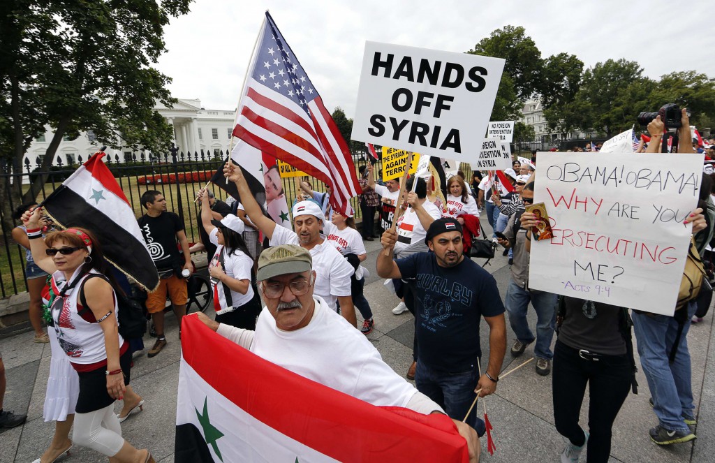 Syrian-American demonstrators march against U.S. military intervention in Syria on Sept. 9 in front of the White House in Washington. PHOTO: CNS/Jim Bourg, Reuters