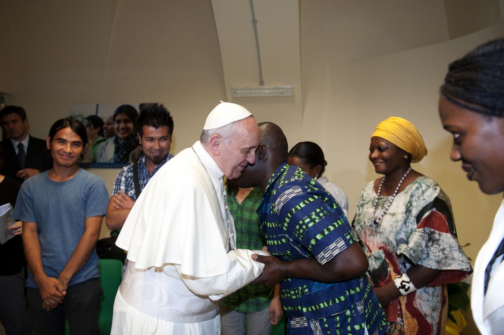 Pope Francis greets refugees during a visit on Sept. 10 to the Astalli Center of the Jesuit Refugee Service in Rome. PHOTO: CNS/Alessia Giuliani, Catholic Press