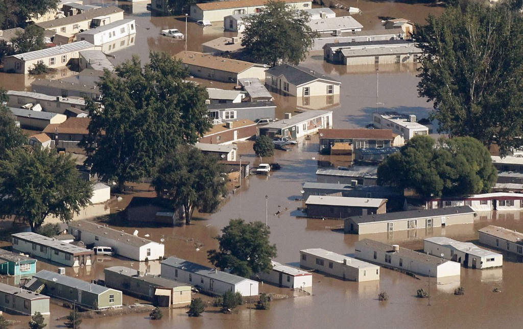 Mobile homes lie flooded in a town in Weld County, Colo., Sept. 17. Search-and-rescue teams bolstered by National Guard troops fanned out across Colorado's flood-stricken landscape, as a week of torrential rains blamed for at least eight deaths and the destruction of at least 1,600 homes. PHOTO: CNS/Rick Wilking, Reuters