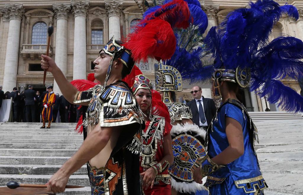 Performers in traditional Mayan warrior dress perform in front of St. Peter's Basilica during Pope Francis' weekly audience on May 8 in St. Peter's Square at the Vatican. PHOTO: CNS/Stefano Rellandini, Reuters