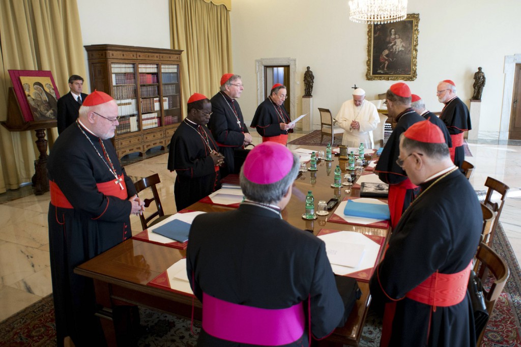 Pope Francis prays during a meeting with cardinals at the Vatican Oct. 1. As a series of consultations aimed at the reform of the Vatican bureaucracy began, the pontiff told his group of cardinal advisers that humility and service attract people to the church, not power and pride. PHOTO: CNS/L'Osservatore Romano via Reuters