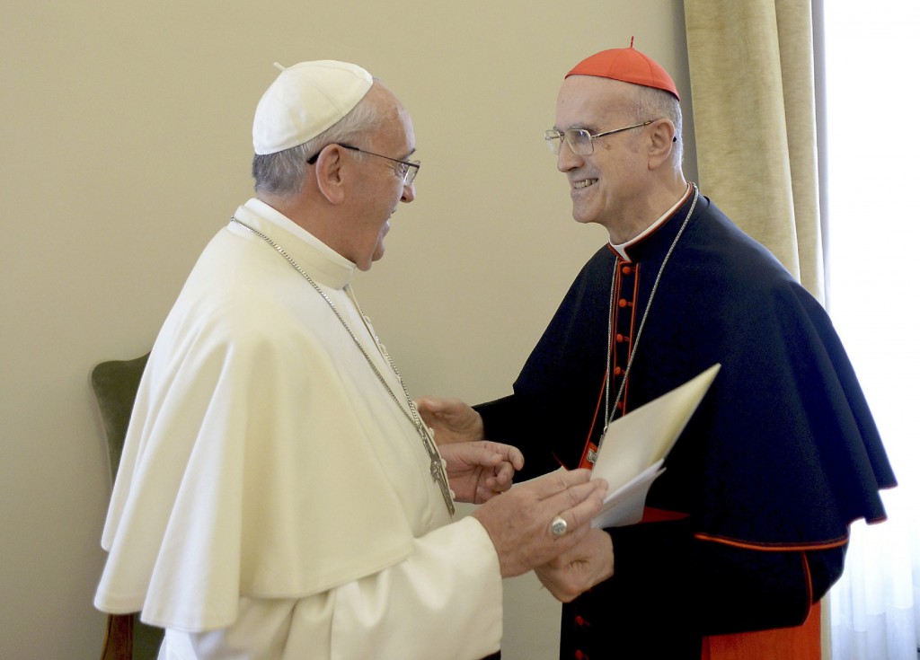 Pope Francis talks with the outgoing Vatican secretary of state, Cardinal Tarcisio Bertone, on Oct. 15 during the cardinal's farewell ceremony at the Vatican. PHOTO: CNS/L'Osservatore Romano via Reuters