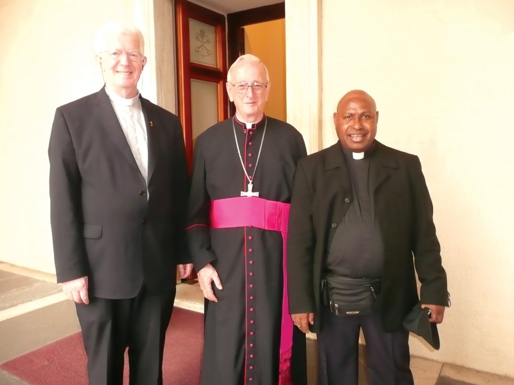 Bishop Anthony Burgess, centre, with two confreres. Bishop Burgess served God among the people on Papua New Guinea for 40 years. PHOTO: ACBC