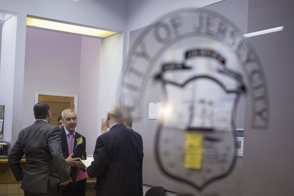 Gary Sabock, center, speaks with other same-sex couples after their weddings at City Hall in Jersey City, N.J., Oct. 21, the same day New Jersey became the 14th U.S. state to legalize same-sex marriage. Church teaching upholds the sanctity of traditional marriage, between one man and one woman, and also teaches that any sexual activity outside of marriage is sinful. PHOTO: CNS/Shannon Stapleton, Reuters