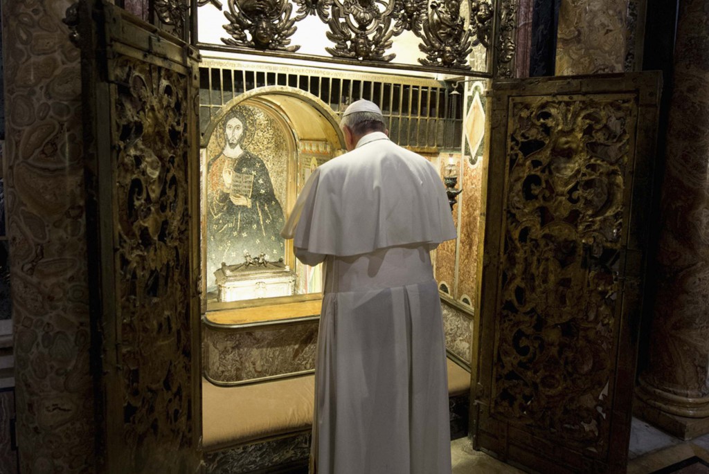 Pope Francis prays at the tomb of St. Peter inside St. Peter's Basilica at the Vatican Nov. 2, All Souls' Day. For the first time, the bones traditionally believed to be the relics of St. Peter the Apostle will be on public display for veneration. PHOTO: CNS/L'Osservatore Romano via Reuters