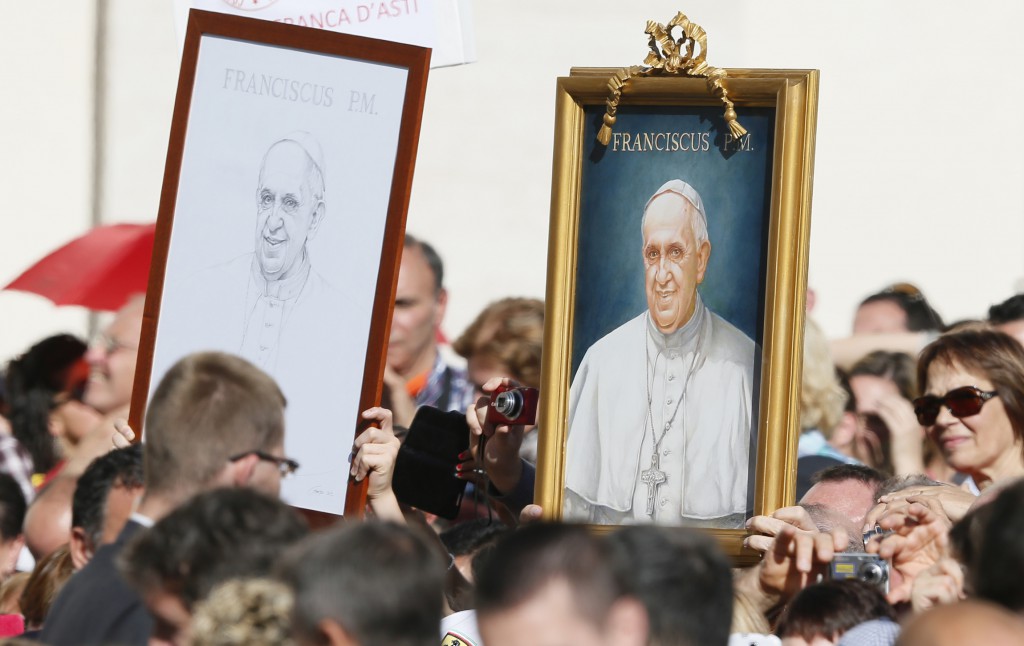 Images of Pope Francis are seen in the crowd during the pontiff's general audience in St. Peter's Square at the Vatican Nov. 6. PHOTO: CNS/Paul Haring