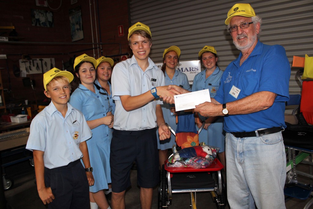 Kolbe Catholic College students with Bob from Wheelchairs for Kids, a non-profit charity that builds wheelchairs for the underprivileged.  PHOTO: Leanne Joyce