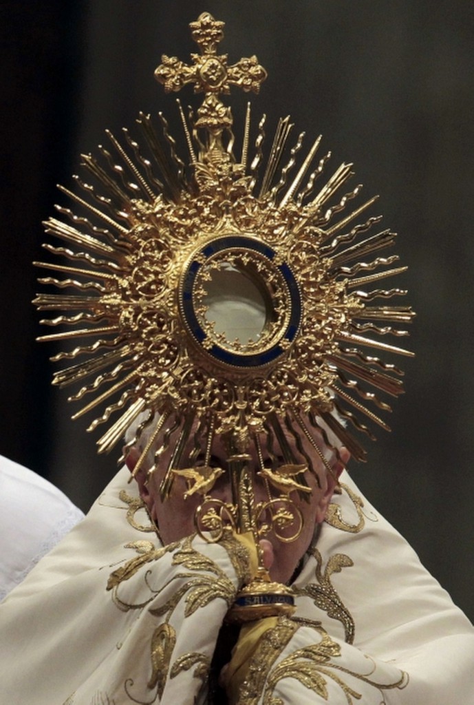 Pope Benedict XVI holds a monstrance during a Vespers service at the Vatican in 2012. PHOTO: CNS