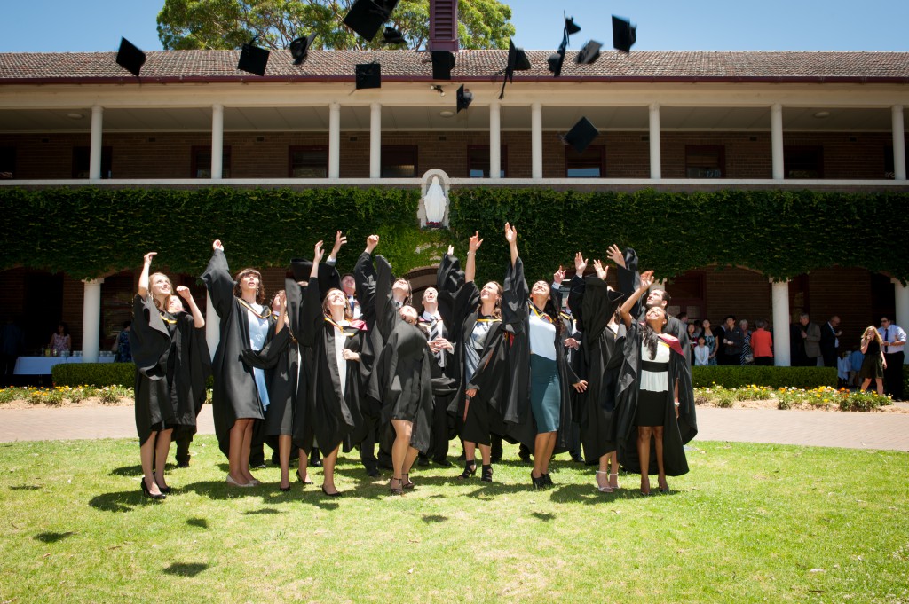 Campion College's 2013 graduates celebrate after the December 12 ceremony. PHOTO: GRAHAM EVANS