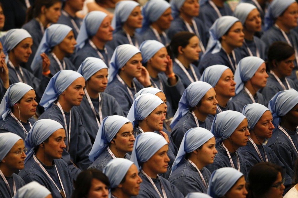 Novices look on as Pope Francis meets with those discerning vocations and those on the path to becoming members of religious orders July 6 in Paul VI hall at the Vatican. PHOTO: CNS/Tony Gentile, Reuters