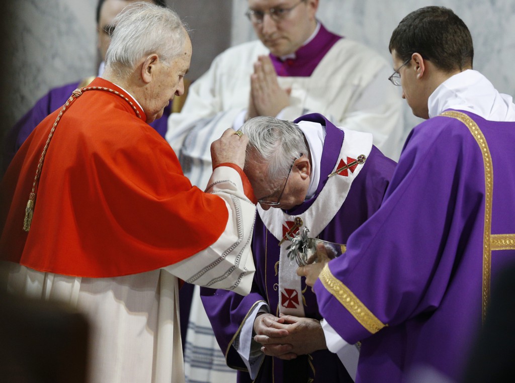 Pope Francis receives ashes from Slovakian Cardinal Jozef Tomko during Ash Wednesday Mass on March 5 at the Basilica of Santa Sabina in Rome. PHOTO: CNS/Paul Haring