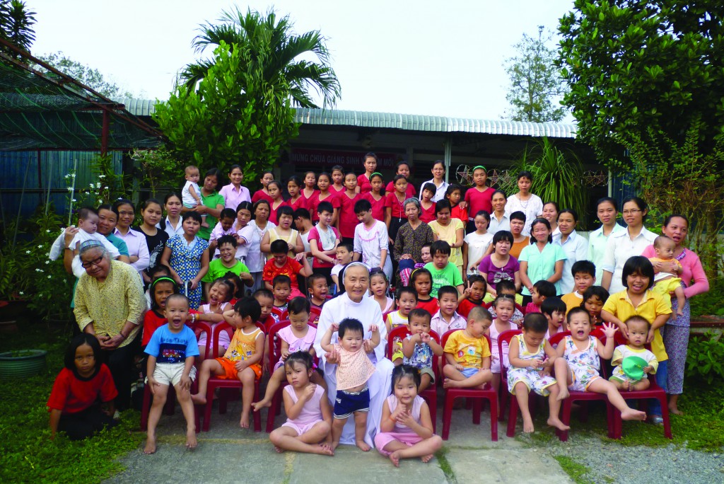 Sr Teresa My Nguyen pictured above with some of the orphan children she helps to care for in Vietnam.