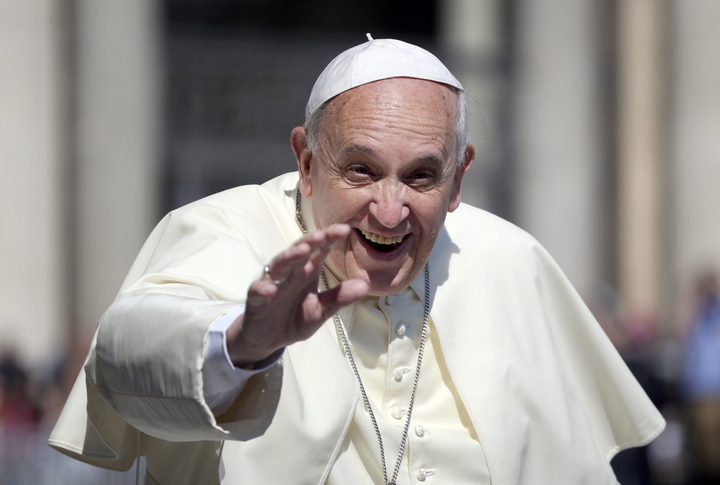 Pope Francis waves as he arrives to lead his weekly general audience in St. Peter's Square at the Vatican June 4. PHOTO: CNS/Alessandro Bianchi, Reuters