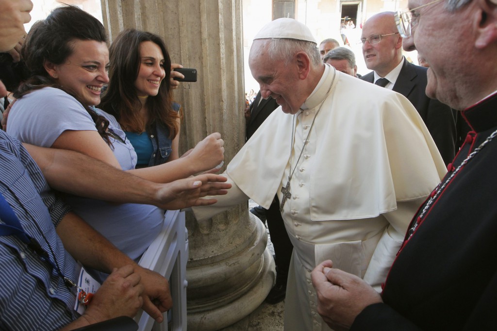 Pope Francis blesses the stomach of a pregnant woman during a visit to Isernia, Italy, July 5. The pope was visiting the Italian region of Molise.  PHOTO: CNS/Ciro De Luca, Reuters