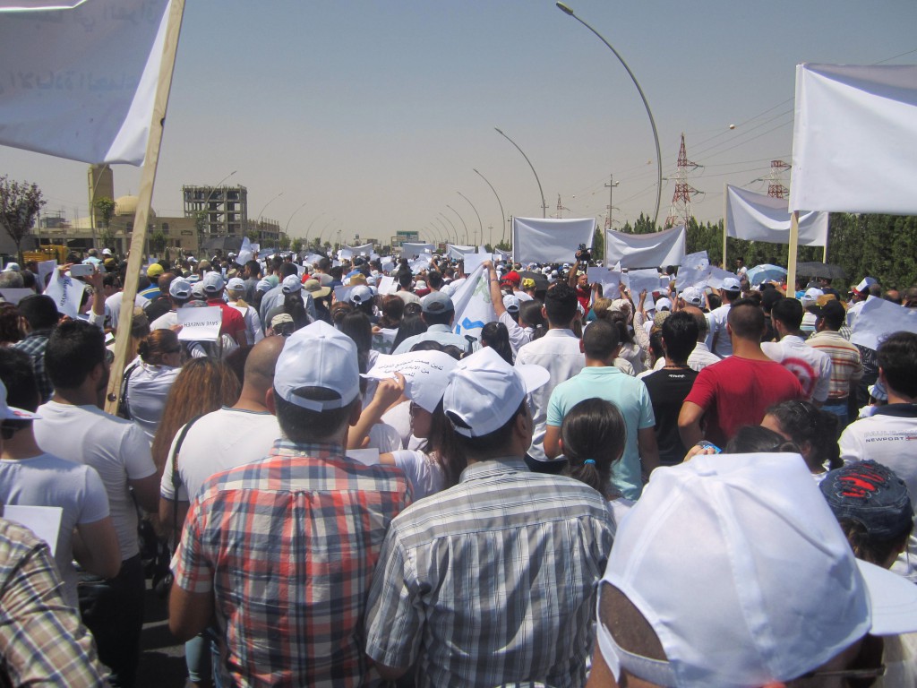 Christian refugees march against persecution by Islamic State fighters outside the U.N. compound near the airport in Irbil, Iraq, July 24. Christians braved temperatures as high as 122 degrees Fahrenheit to make their voices heard. PHOTO: CNS photo/Sahar Mansour